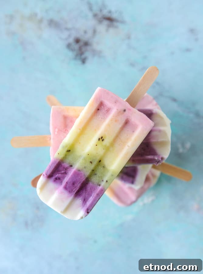 Rainbow Fruity Frozen Yogurt Popsicles: Refreshing Summer Treat 7 rainbow froyo pops I howsweeteats.com