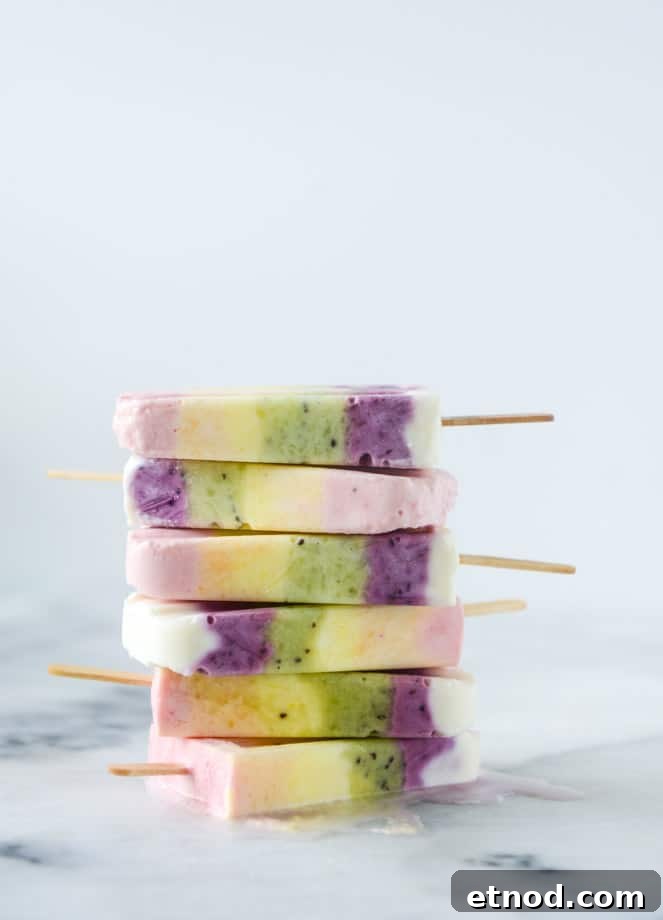 Rainbow Fruity Frozen Yogurt Popsicles: Refreshing Summer Treat 8 rainbow froyo pops I howsweeteats.com