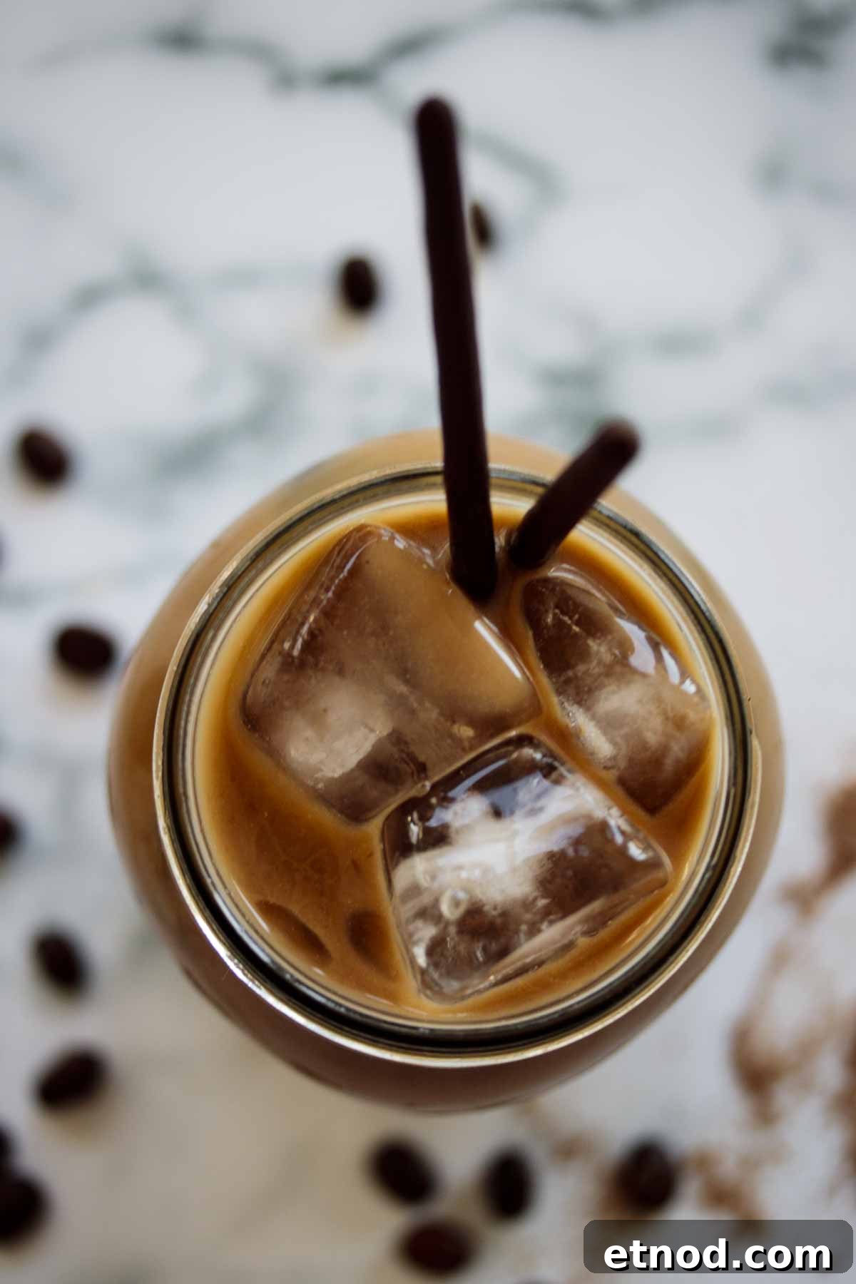 Iced Chocolate Almond Milk Shaken Espresso Recipe 3 Shaken Espresso drink seen from above, focus on the ice cubes.
