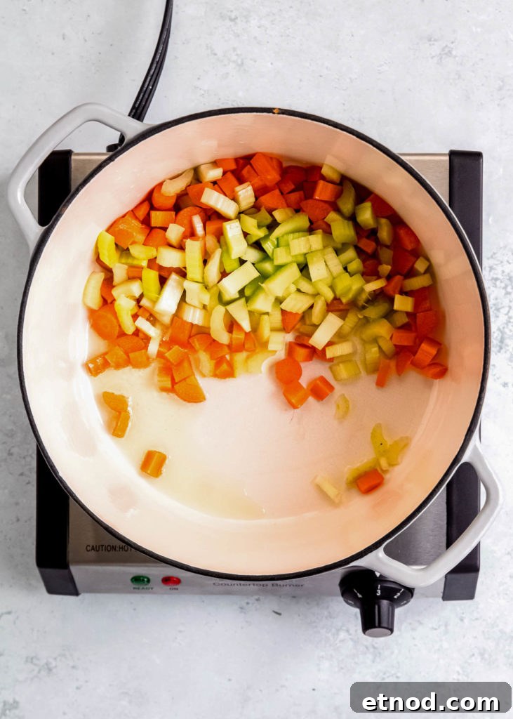 Creamy Roasted Red Pepper Soup with Garlic and Basil 6 carrots and celery in a dutch oven