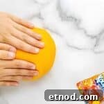 Make Homemade Kool-Aid Play Dough: Bright, Scented Recipe 8 Hands kneading orange play-dough.