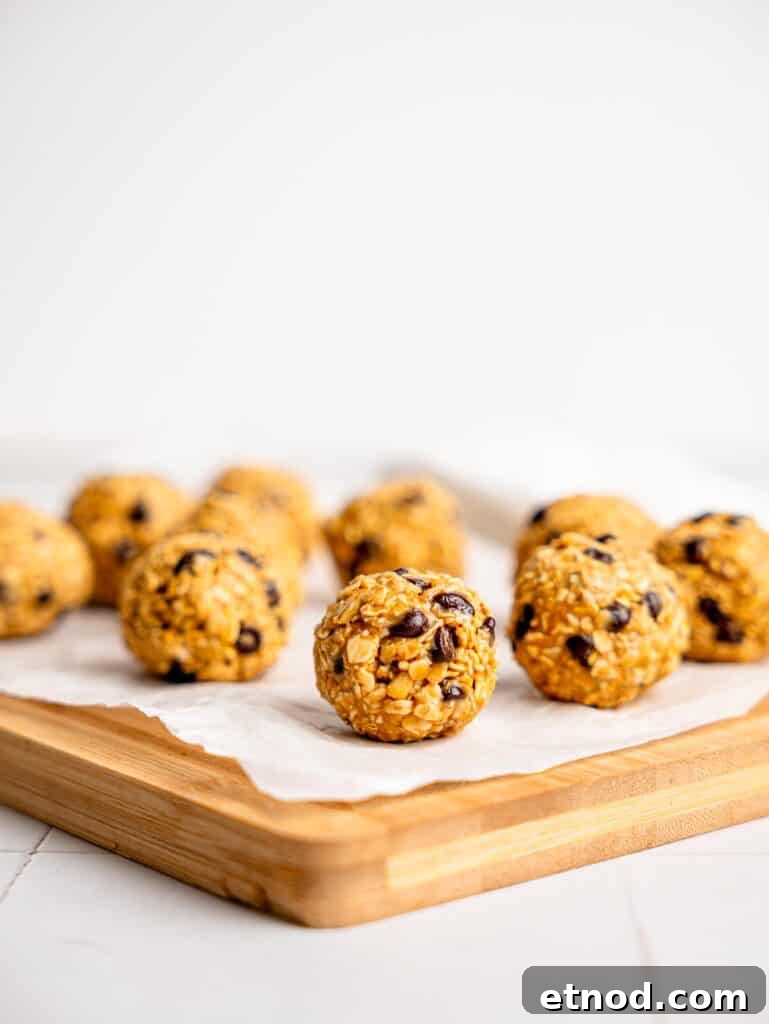 3 Ingredient Peanut Butter Oatmeal Balls on a sheet of parchment paper.