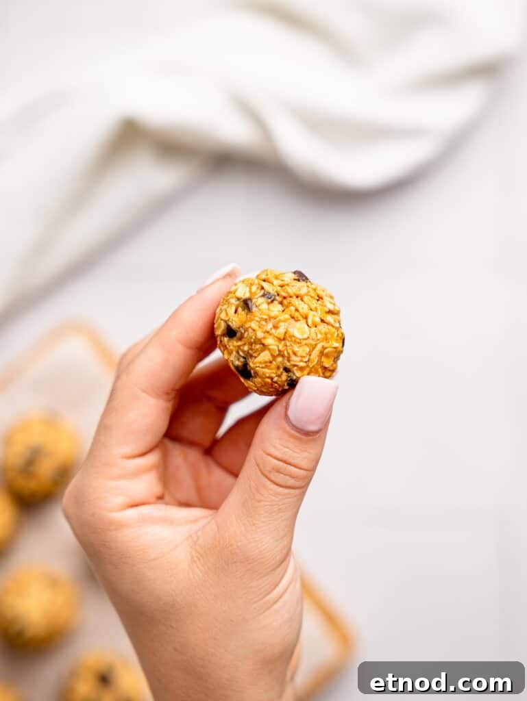 3 ingredient peanut butter oatmeal balls rolled into a ball.