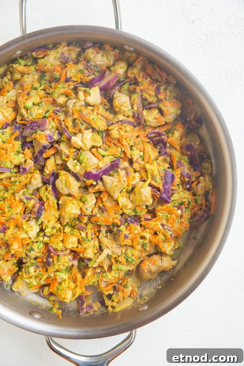 Thai Chicken and Zucchini Skillet Recipe for Quick Weeknight Meals 2 stainless steel skillet of chicken and vegetables