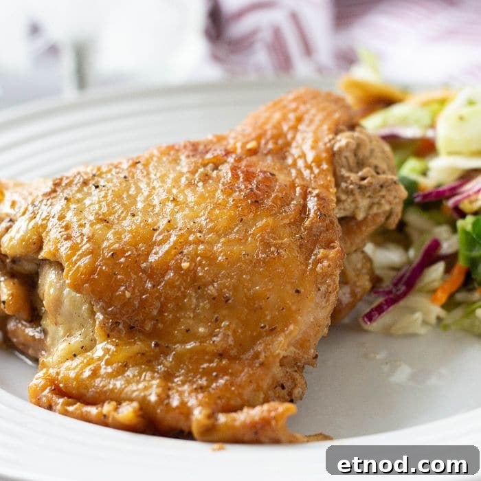 Instant Pot Honey Garlic Chicken (Video Tutorial) 4 honey garlic chicken thigh on plate with salad by it