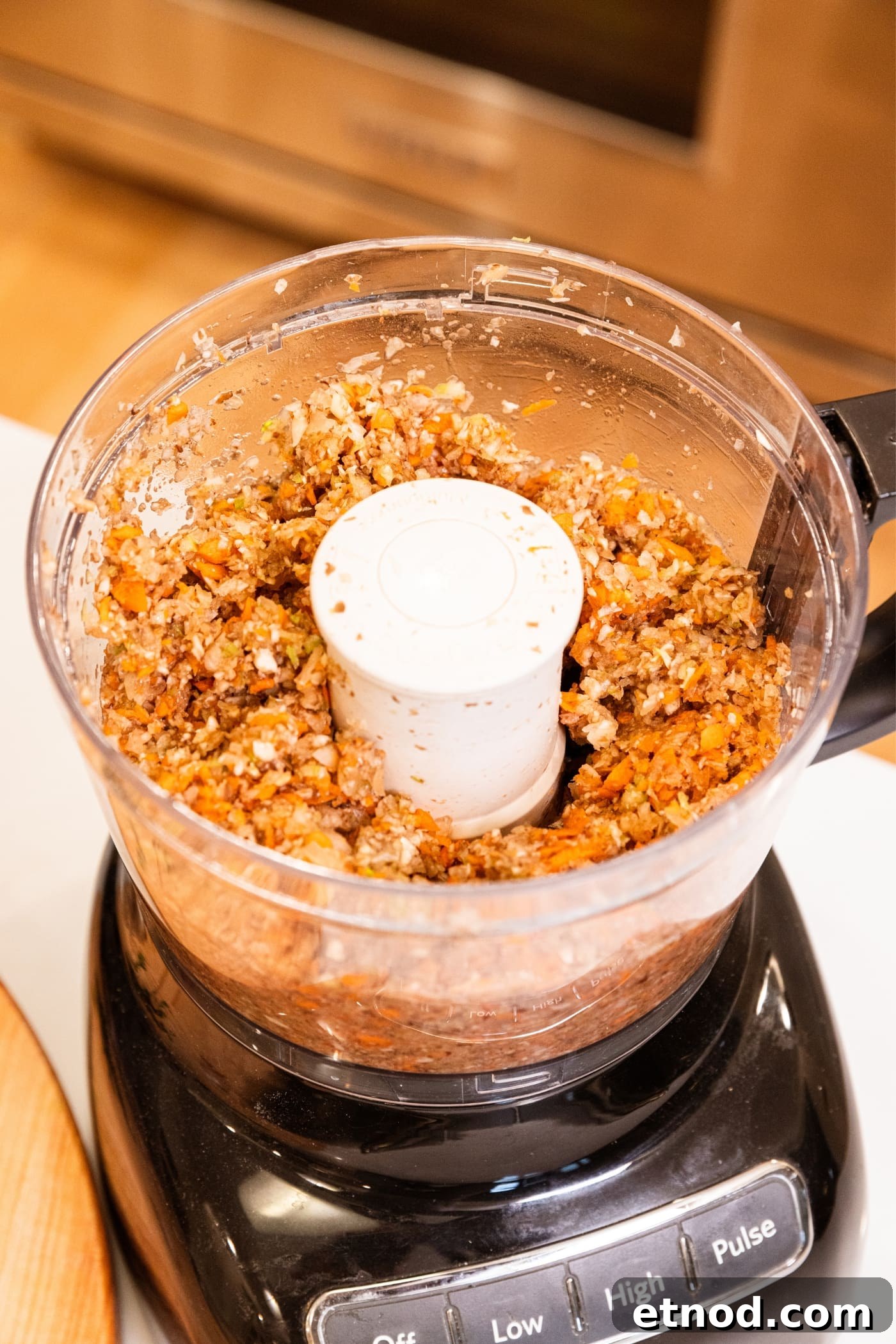 Classic Comfort Meatloaf Recipe for Perfect Weeknight Dinners 7 Bowl of food processor still sitting on food processor after being chopped by machine.