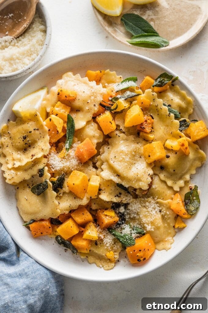 Brown Butter Ravioli with Roasted Butternut Squash Filling 3 Low pasta bowl full of ravioli with brown butter sauce, butternut squash, sage, and Parmesan.