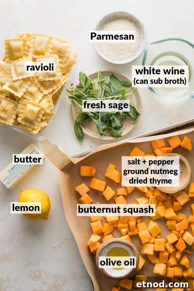 Brown Butter Ravioli with Roasted Butternut Squash Filling 4 Labeled overhead photo of cubed butternut squash on a sheet pan, seasonings, olive oil, fresh sage leaves, cheese ravioli, white wine, a fresh lemon, butter, and Parmesan cheese.