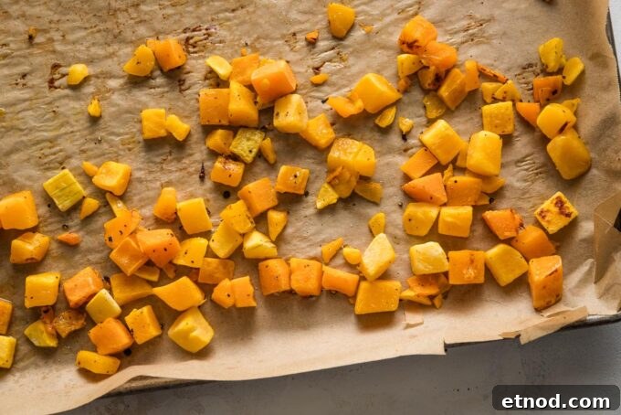 Brown Butter Ravioli with Roasted Butternut Squash Filling 5 Butternut squash cubes roasted on a large, parchment-lined baking sheet.