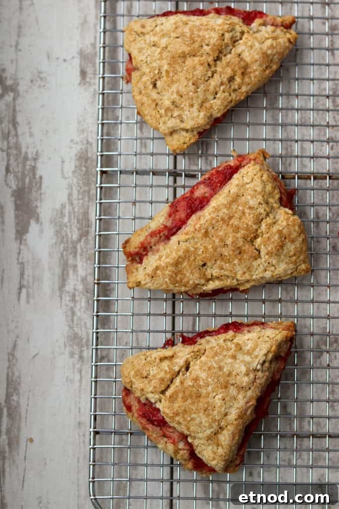 Strawberry rhubarb scones on a cooling rack