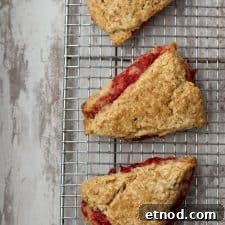 Strawberry rhubarb scones on a cooling rack