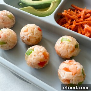 Flaky Salmon Rice Balls: Simple Recipe for Perfect Onigiri 15 Salmon rice balls served with avocado and carrots.