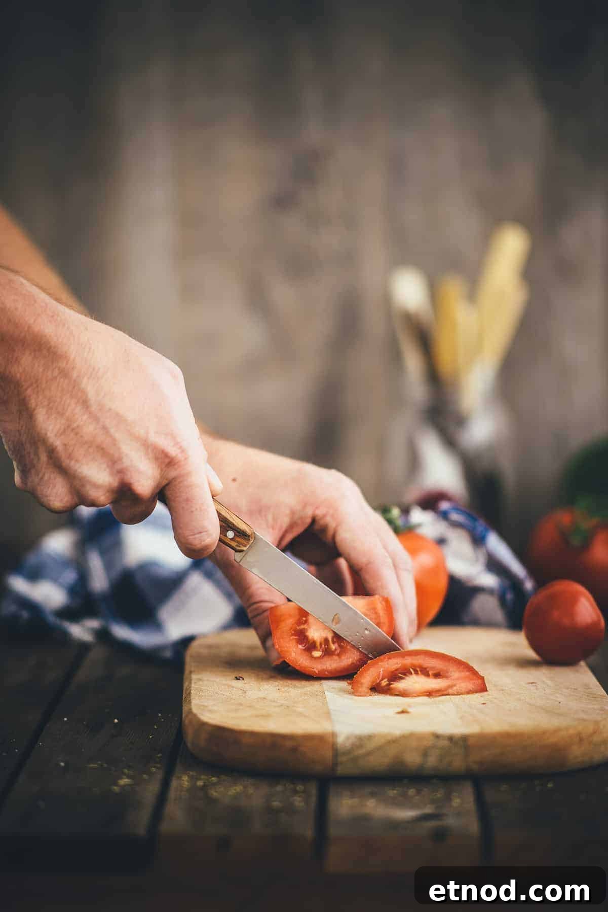 How to Make Authentic Greek Salad: Classic Recipe & Tips 4 tomatoes being sliced on chopping board