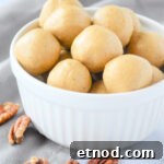 Bowl of spiced almond butter energy bites with pecans