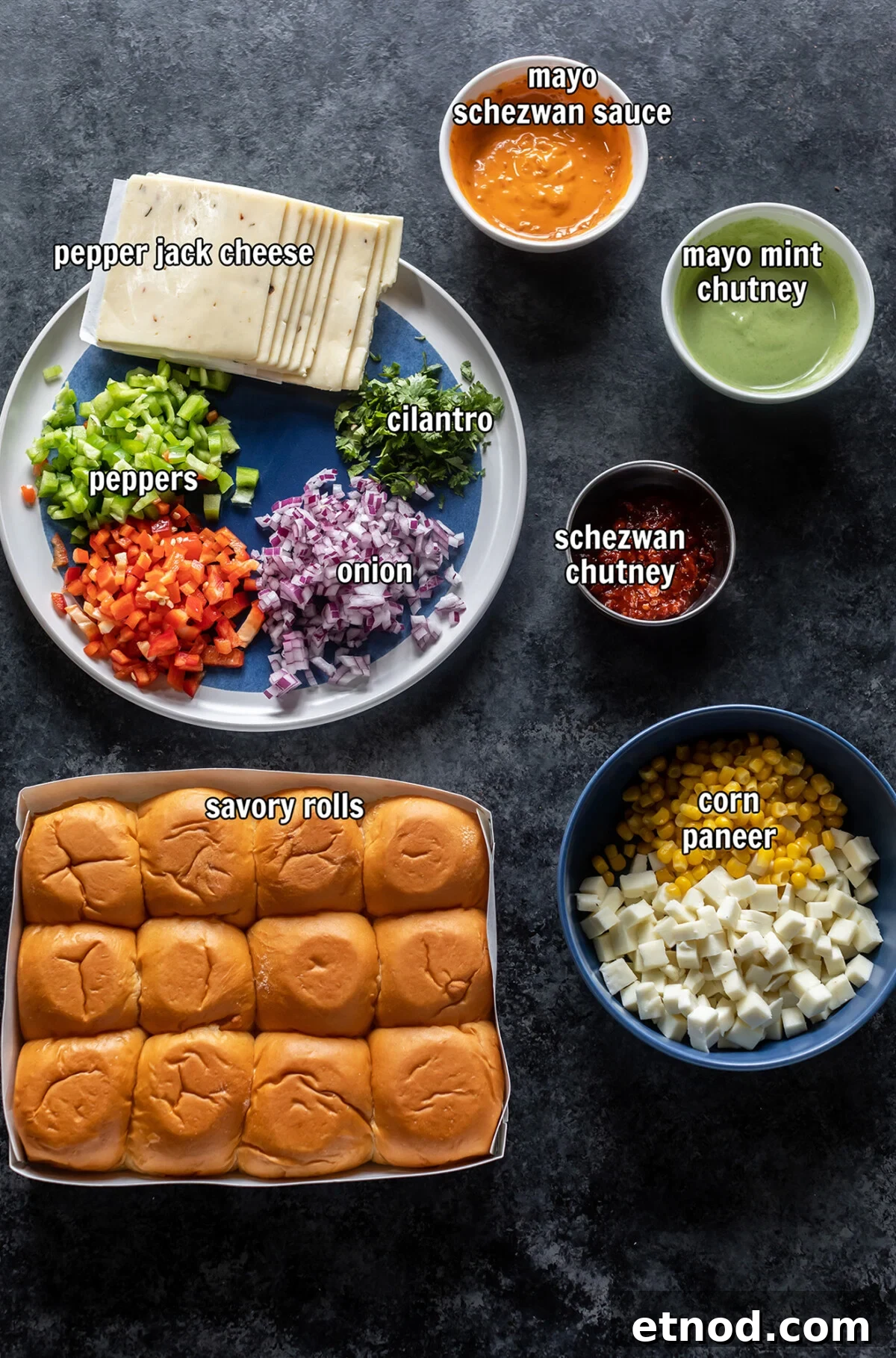 ingredients for making schezwan paneer sliders arranged on board