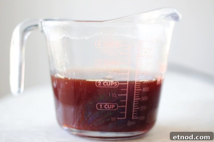 Boiled Apple Cider Syrup: Step-by-Step Recipe with Video 13 boiled cider in a glass measuring cup