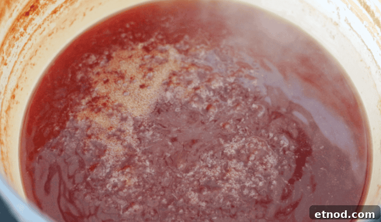Boiled Apple Cider Syrup: Step-by-Step Recipe with Video 4 pot with simmering apple cider