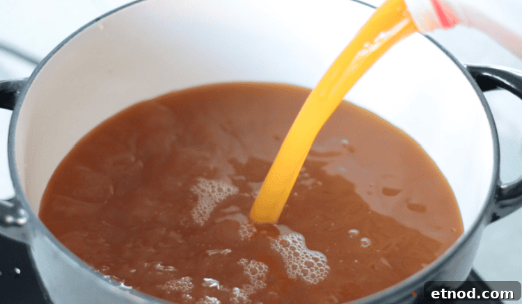 Boiled Apple Cider Syrup: Step-by-Step Recipe with Video 8 dutch oven with gallon of cider poured inside