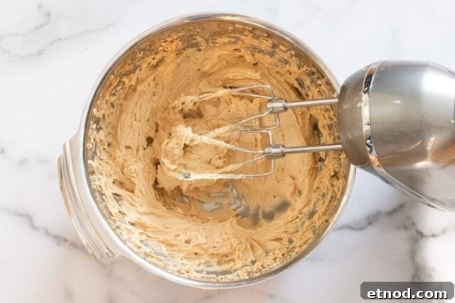 Making the batter for peanut butter crackles.