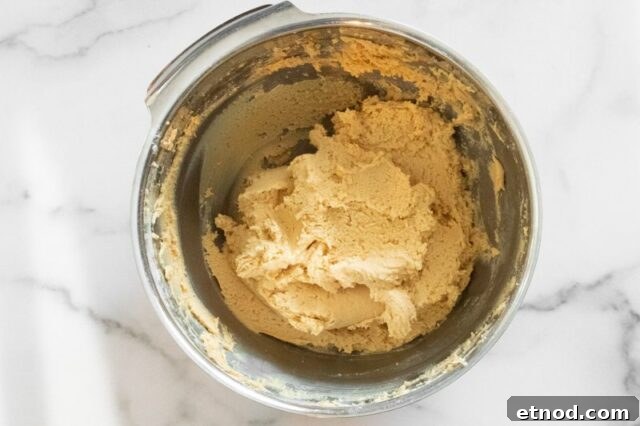 Making the batter for peanut butter crackles.