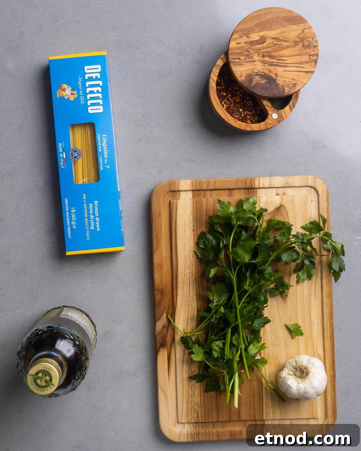 Recipe ingredients shown: box of linguine, hot red pepper flakes, extra virgin olive oil, flat-leaf Italian parsley, and garlic.