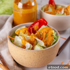 square crop of two bowls of salad with ginger dressing.