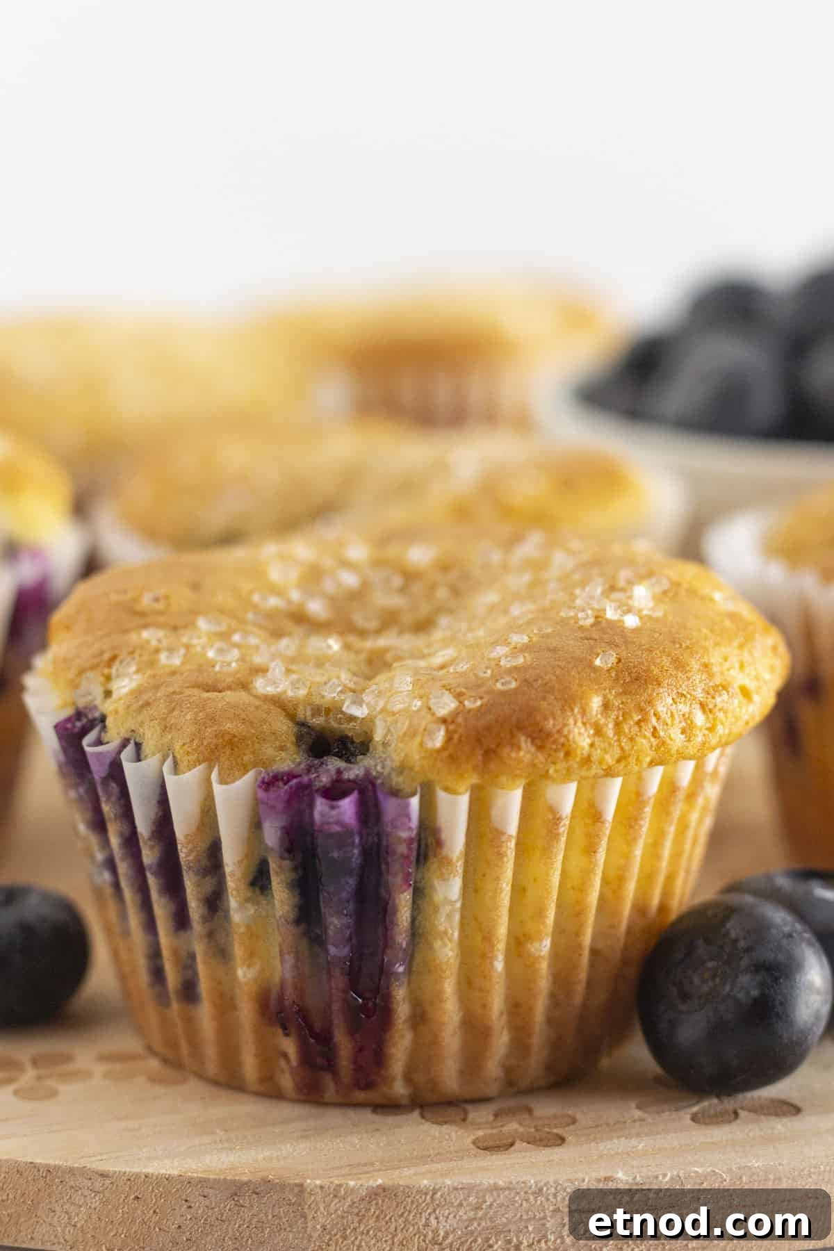 Quick Blueberry Muffins from Cake Mix — Moist & Tender Recipe 2 Cake mix blueberry muffins on a tray and ready to serve.