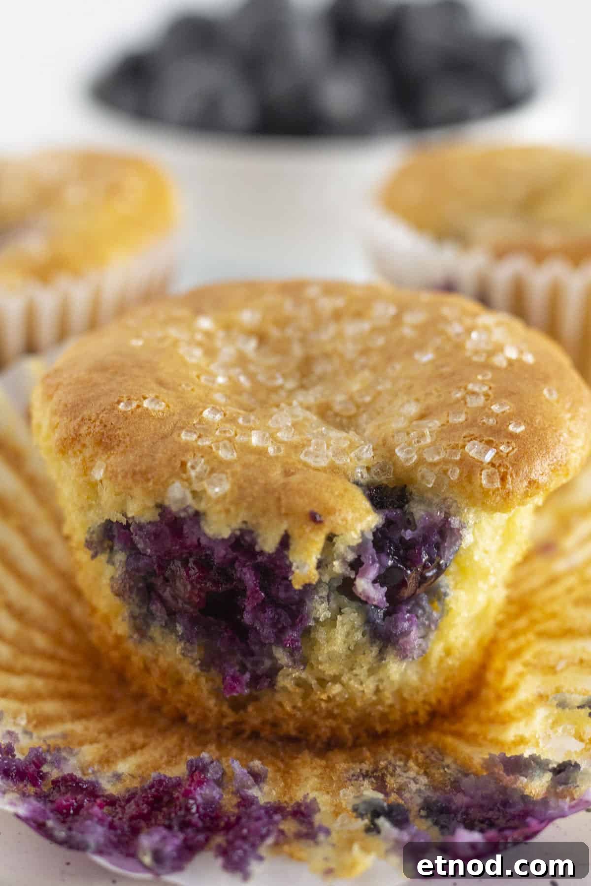 Quick Blueberry Muffins from Cake Mix — Moist & Tender Recipe 6 Removing the cupcake liner from the baked muffins after they were cooled.