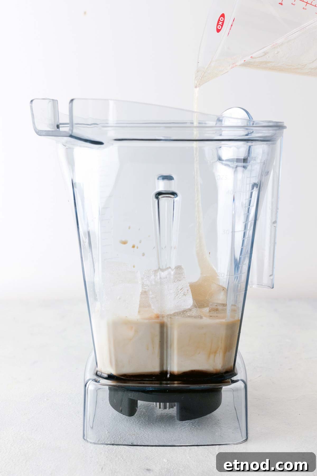 How to Make a Starbucks Mocha Frappuccino at Home 6 Coffee, milk, ice, and homemade Frappuccino base syrup in a blender.