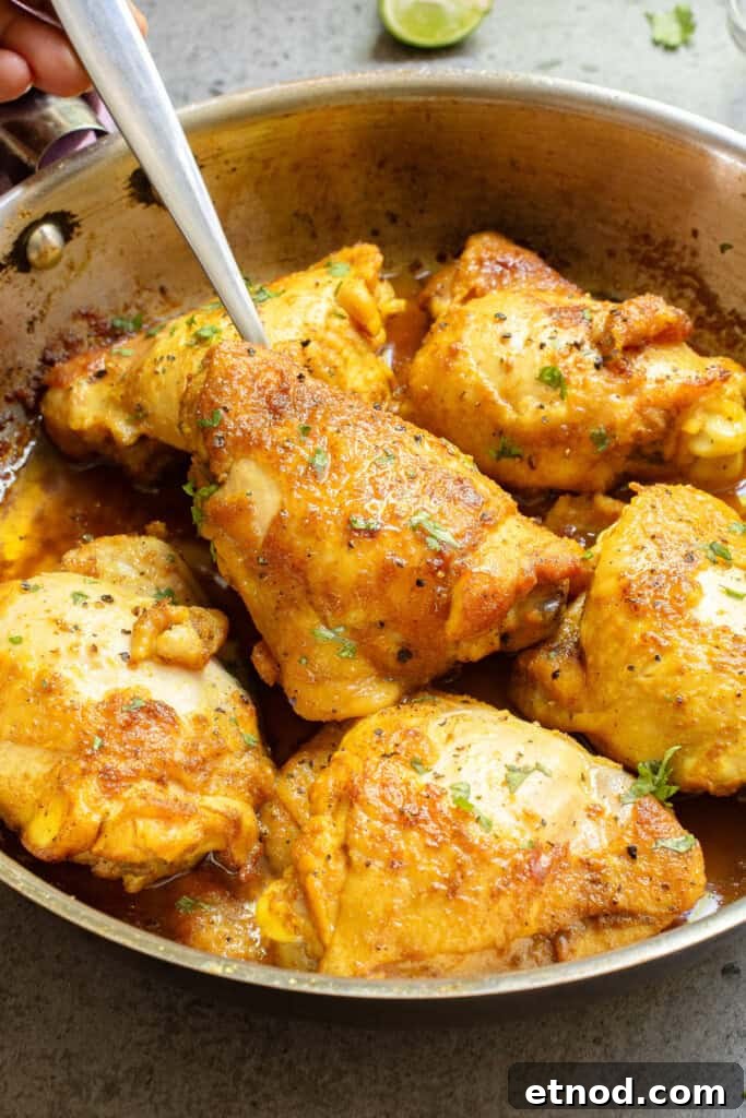 Turmeric Chicken Recipe: Flavorful Roast with Golden Spice 9 Turmeric Chicken with fork in skillet