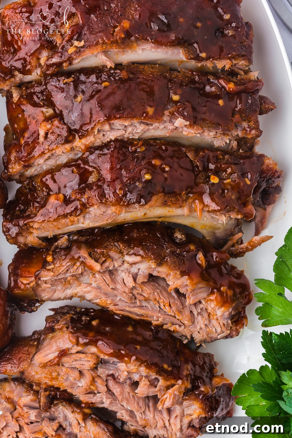 Baked Ribs - Tender ribs seasoned with a bold, flavorful sauce are baked in the oven until the meat is fall-off-the-bone. Comfort on a plate!