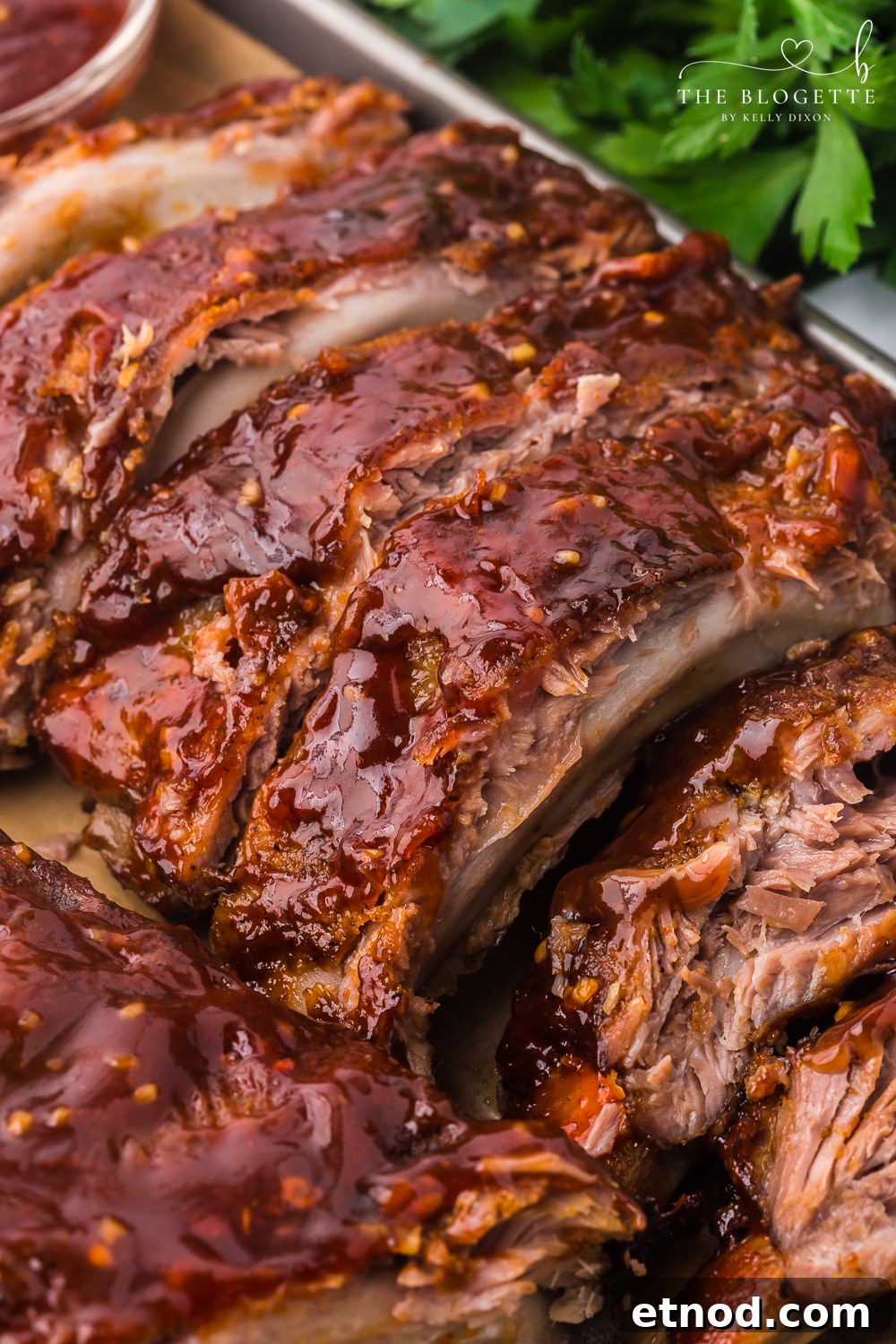 Baked Ribs - Tender ribs seasoned with a bold, flavorful sauce are baked in the oven until the meat is fall-off-the-bone. Comfort on a plate!