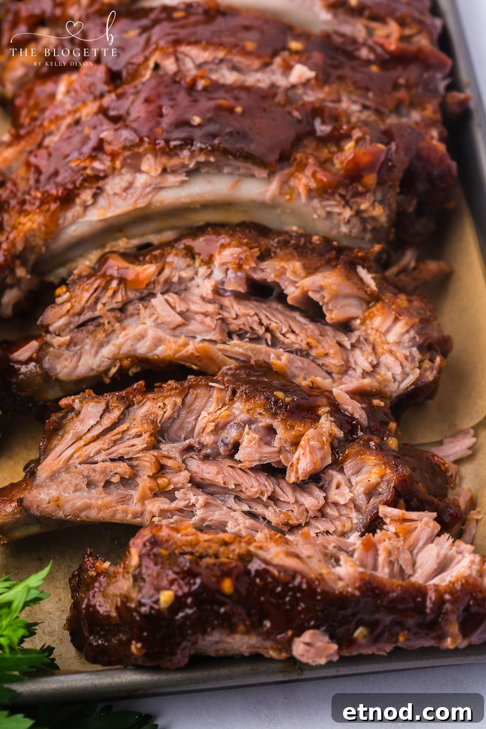 Baked Ribs - Tender ribs seasoned with a bold, flavorful sauce are baked in the oven until the meat is fall-off-the-bone. Comfort on a plate!