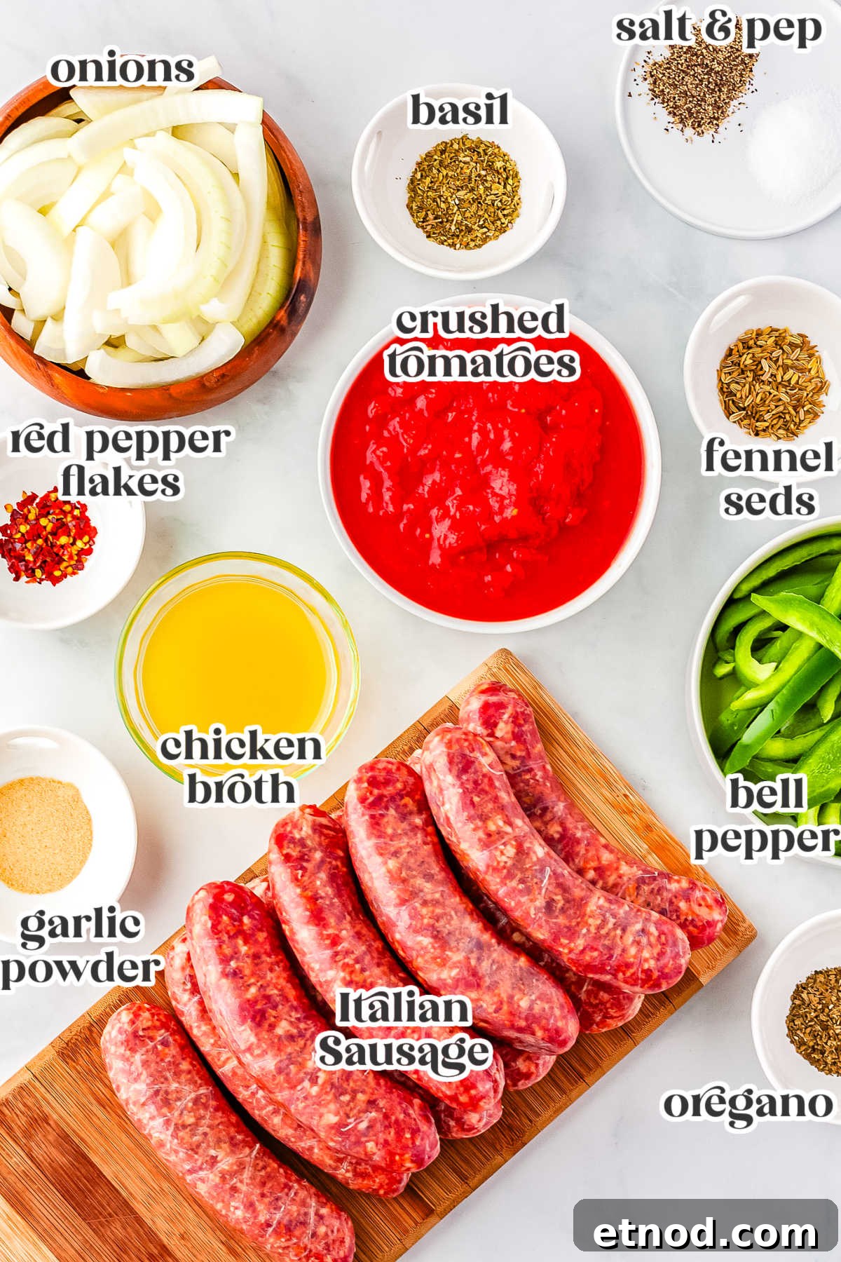 Slow Cooker Sausage and Peppers Recipe for Tender, Flavorful Meals 3 All of the ingredients needed to make this recipe with text overlay labeling the ingredients.