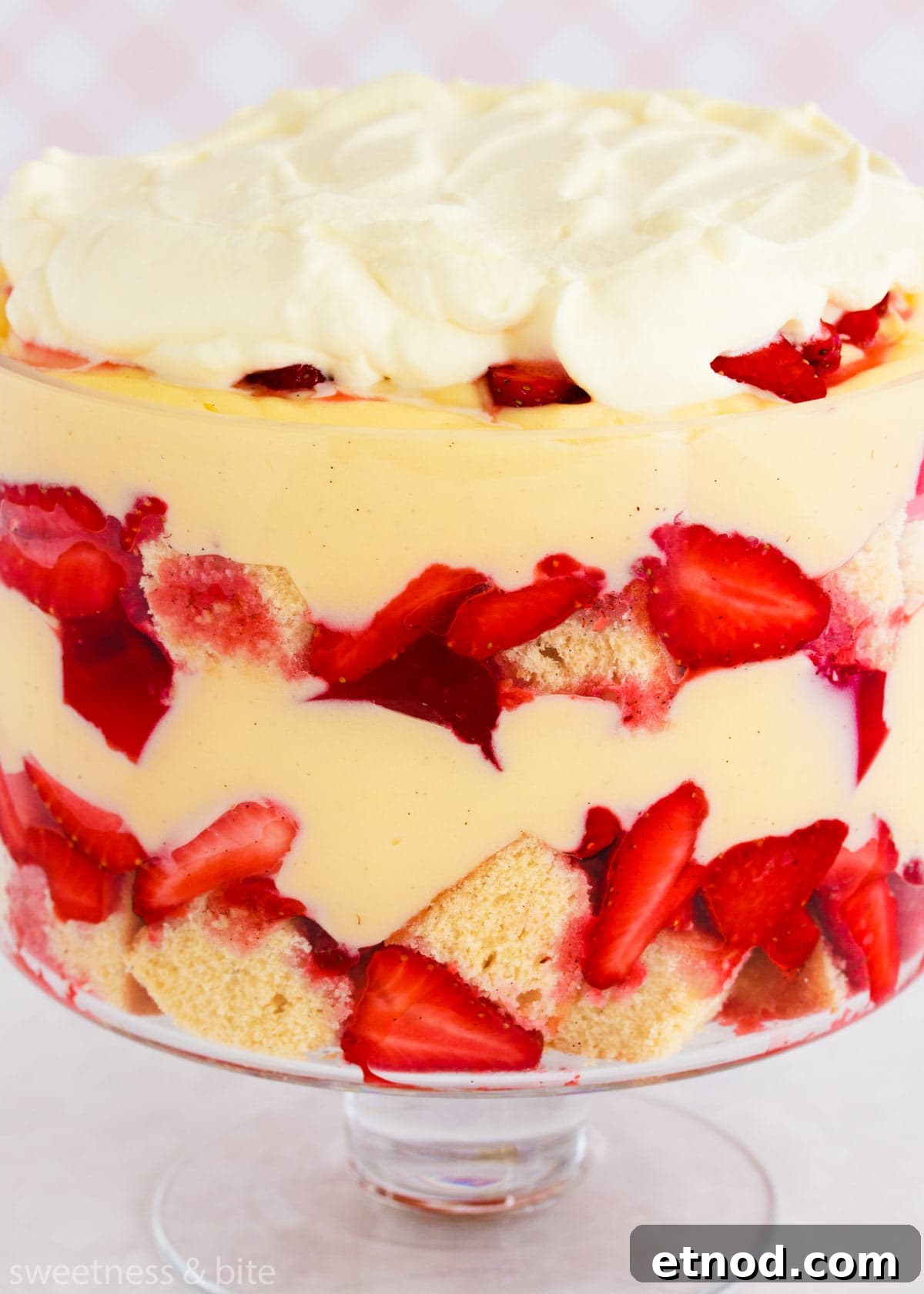 Gluten-Free Trifle Recipe: Light, Layered Dessert for Guests 9 Close up of the layers in the gluten free trifle - sponge cake, strawberries, pink jelly, custard and whipped cream