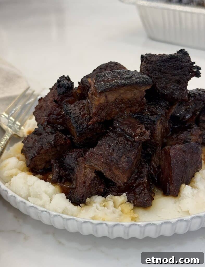 Oven-Baked Burnt Ends with Hot Honey Barbecue Glaze 2 oven baked burnt ends over mashed potatoes