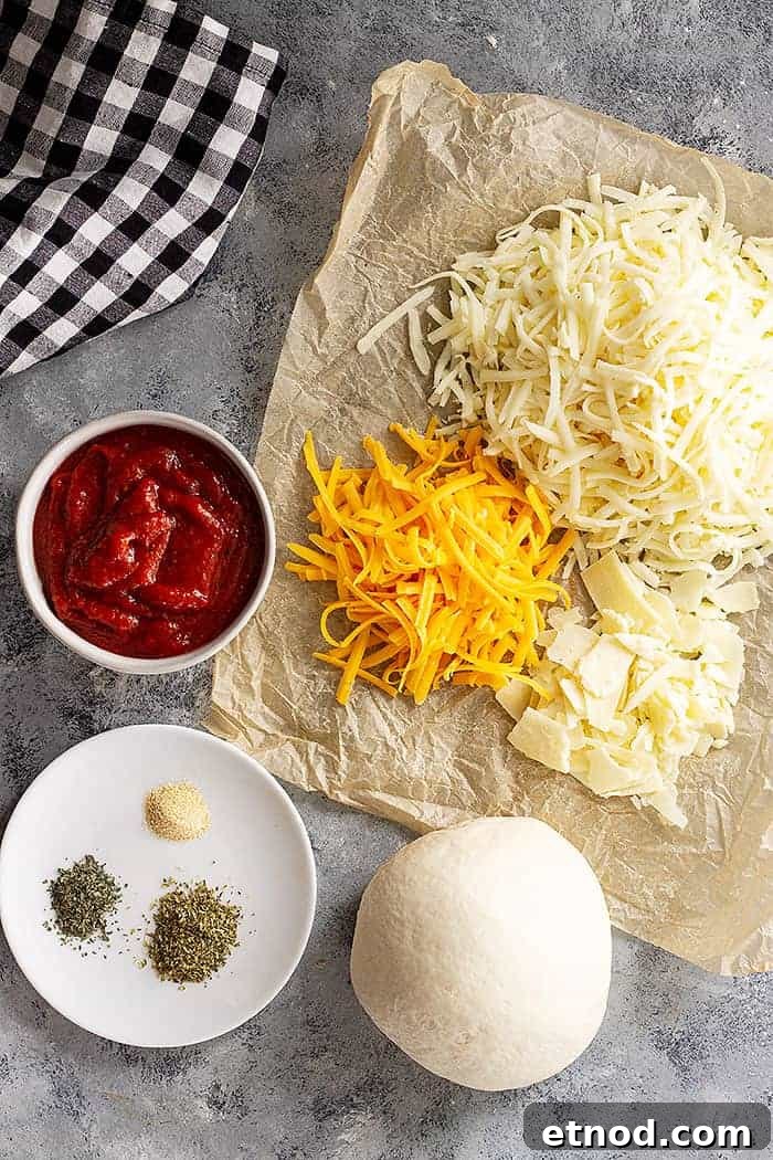overhead: ingredients needed for cheesy pizza
