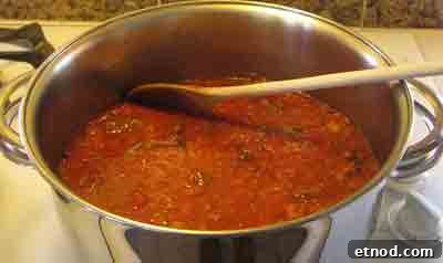 Greek Beef with Artichokes Recipe (Moschari me Agkinares) 11 Add the grated tomatoes to the beef for moschari-me-agkinares