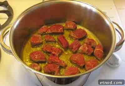 Greek Beef with Artichokes Recipe (Moschari me Agkinares) 7 Add beef to hot oil for beef with artichokes moschari-me-agkinares
