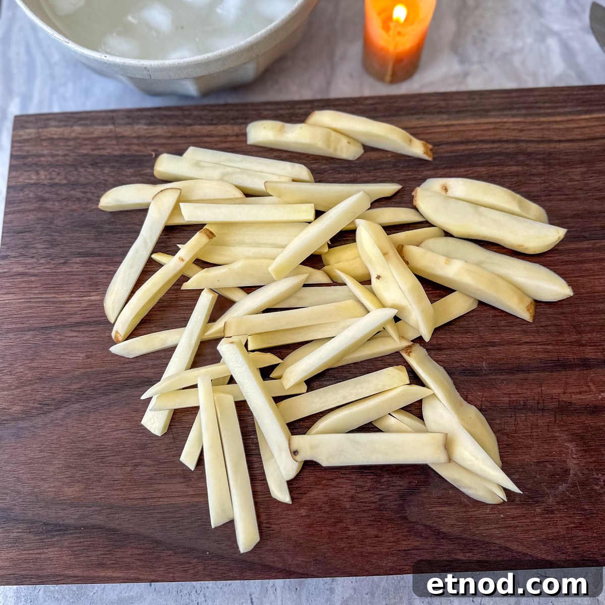 Garlic Parmesan Oven-Baked Steak Fries Recipe 4 Cut potatoes into strips