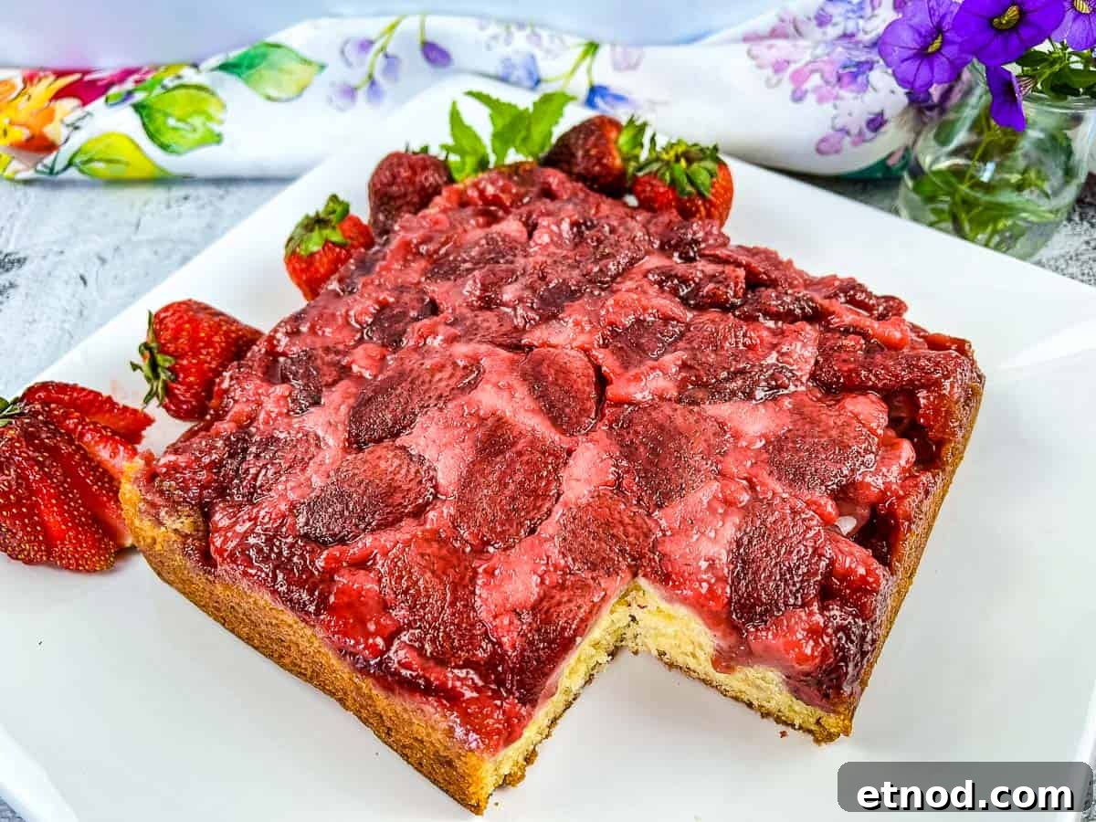 21 Quirky-Looking Desserts That Disappear First at Parties 14 Strawberry Upside Down Cake with a slice missing.