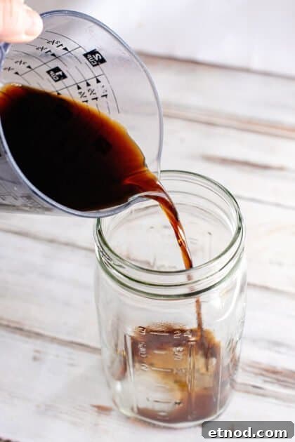 Place soy sauce in large jar.