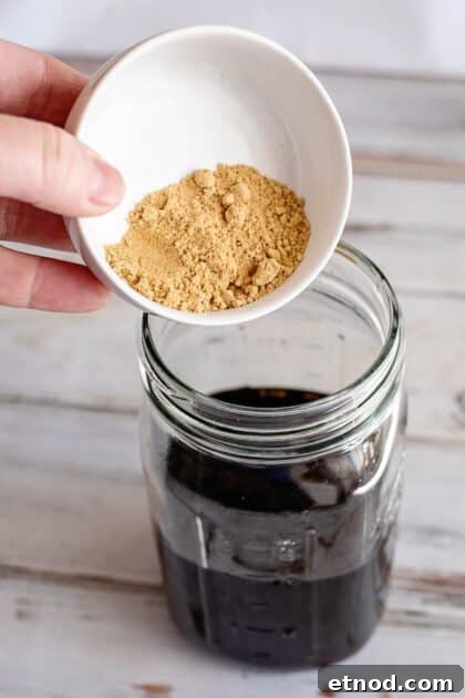 Add ground ginger to jar.