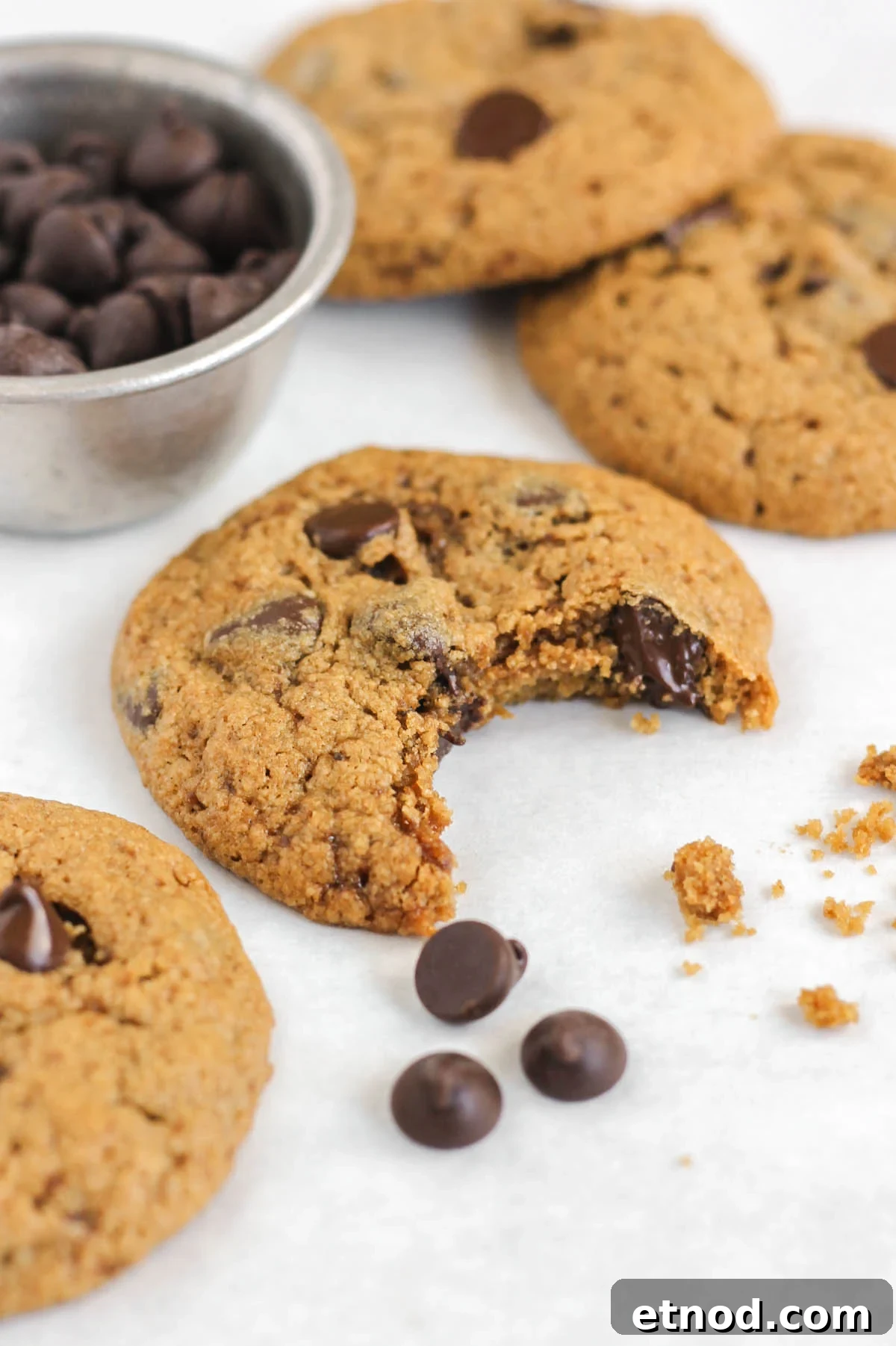 Oat flour chocolate chip cookie with a bite taken out.