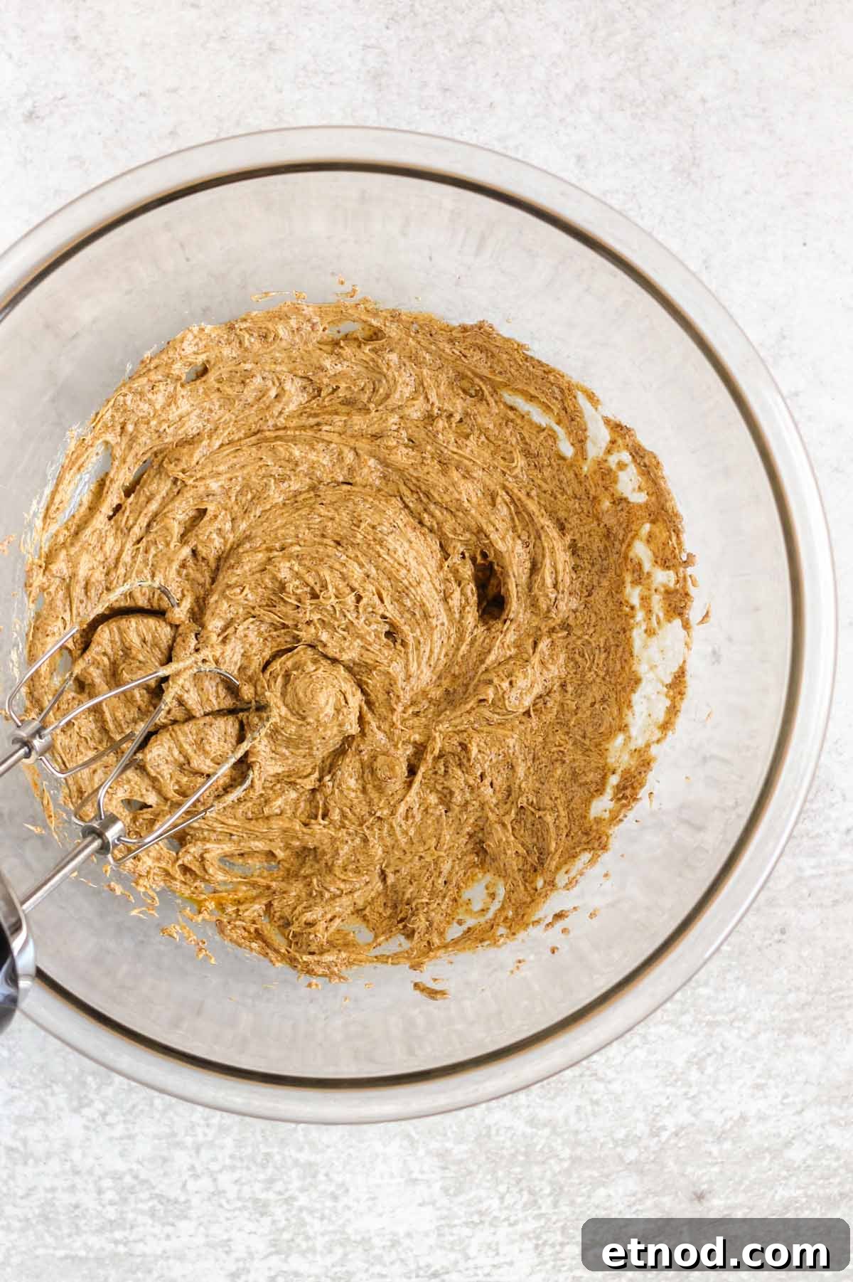 Butter, coconut sugar, egg and vanilla mixed together in a mixing bowl.