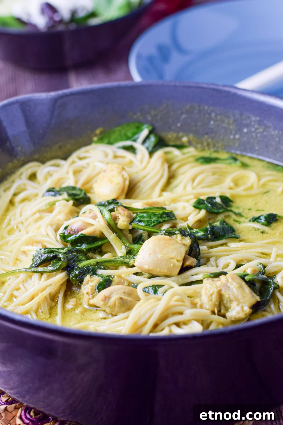 Spicy Chicken Curry Noodles with Coconut and Lime 5 A pan with curry sauce, noodles, spinach and chicken