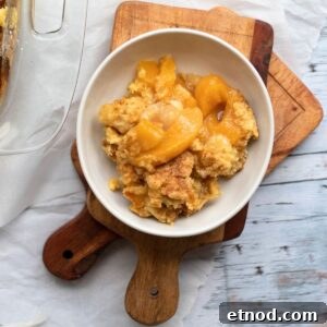 5-Ingredient Peach Cobbler Using Cake Mix Recipe 14 peach cobbler in a white bowl