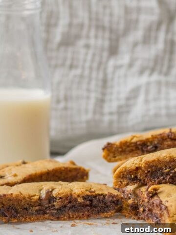 chocolate chip tahini bars with a glass of milk