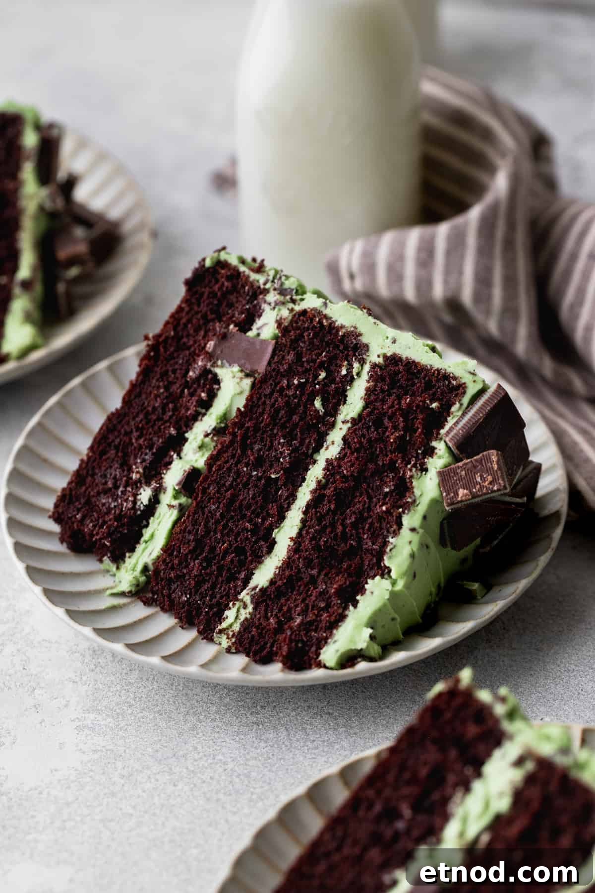 Andes Mint Chocolate Cake Recipe: Rich, Decadent Layer Cake 13 Slice of cake on a plate with a glass of milk.
