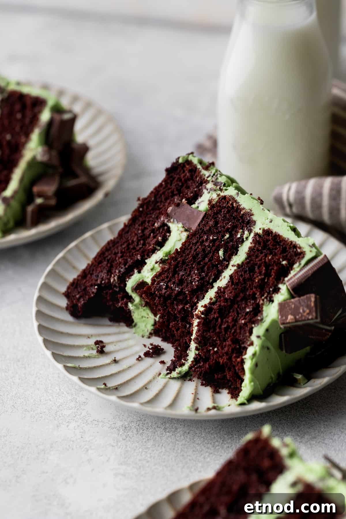 Andes Mint Chocolate Cake Recipe: Rich, Decadent Layer Cake 3 Bites missing from slice of chocolate mint cake.